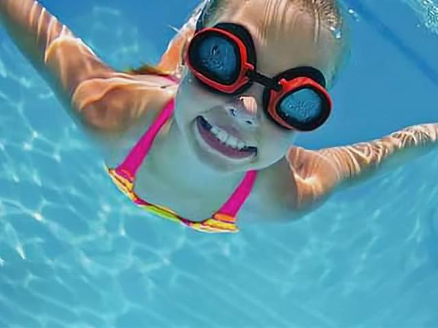 Swimming girl underwater
